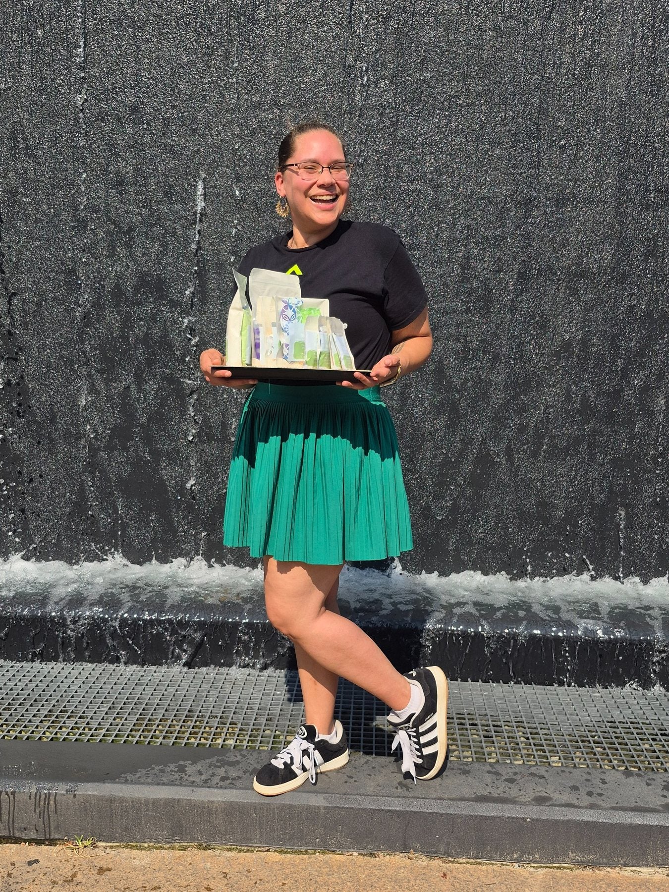 ReUp founder holding a tray of personal care kits
